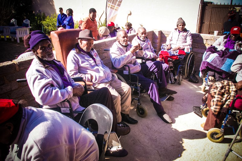 Volunteers painting and cleaning during Mandela Day at MOAH